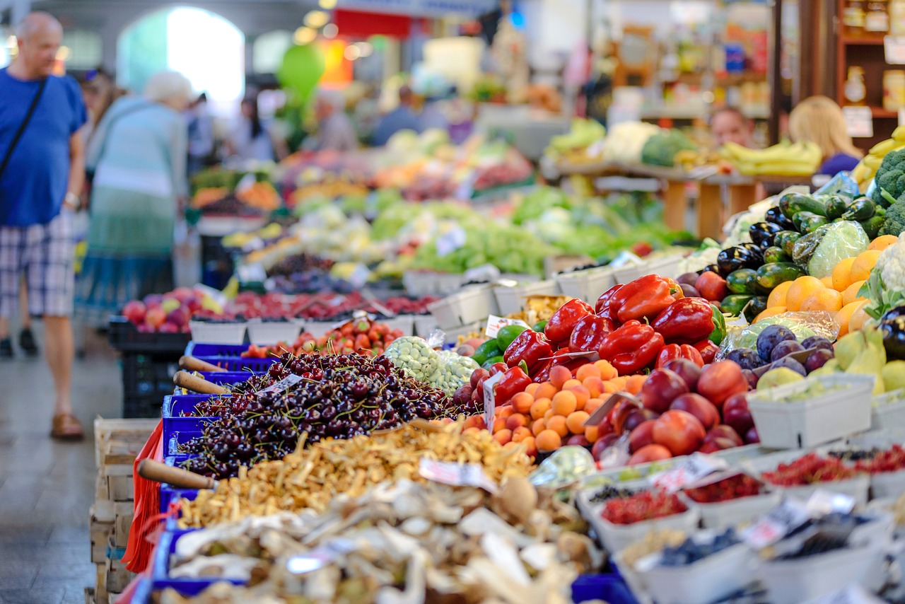 An image showcasing a vibrant, sunlit grocery store aisle lined with neatly arranged rows of fresh produce, organic products, and colorful labels, inviting readers to embrace health-conscious grocery shopping